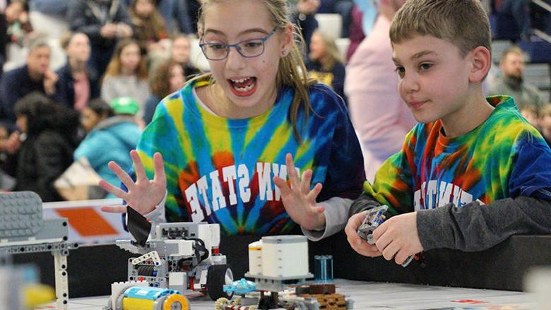 Smart Software team members Ryan Avram and Caylyn Hauser present their robot during the tournament.