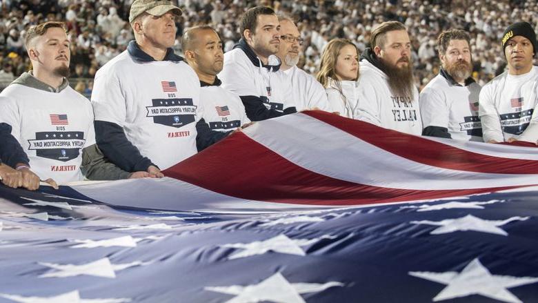 Veterans hold flag