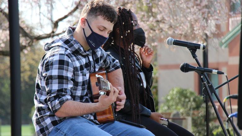 Two students perform on stage at SpringFest, a musical event hosted by Berks Residence Life on April 23.